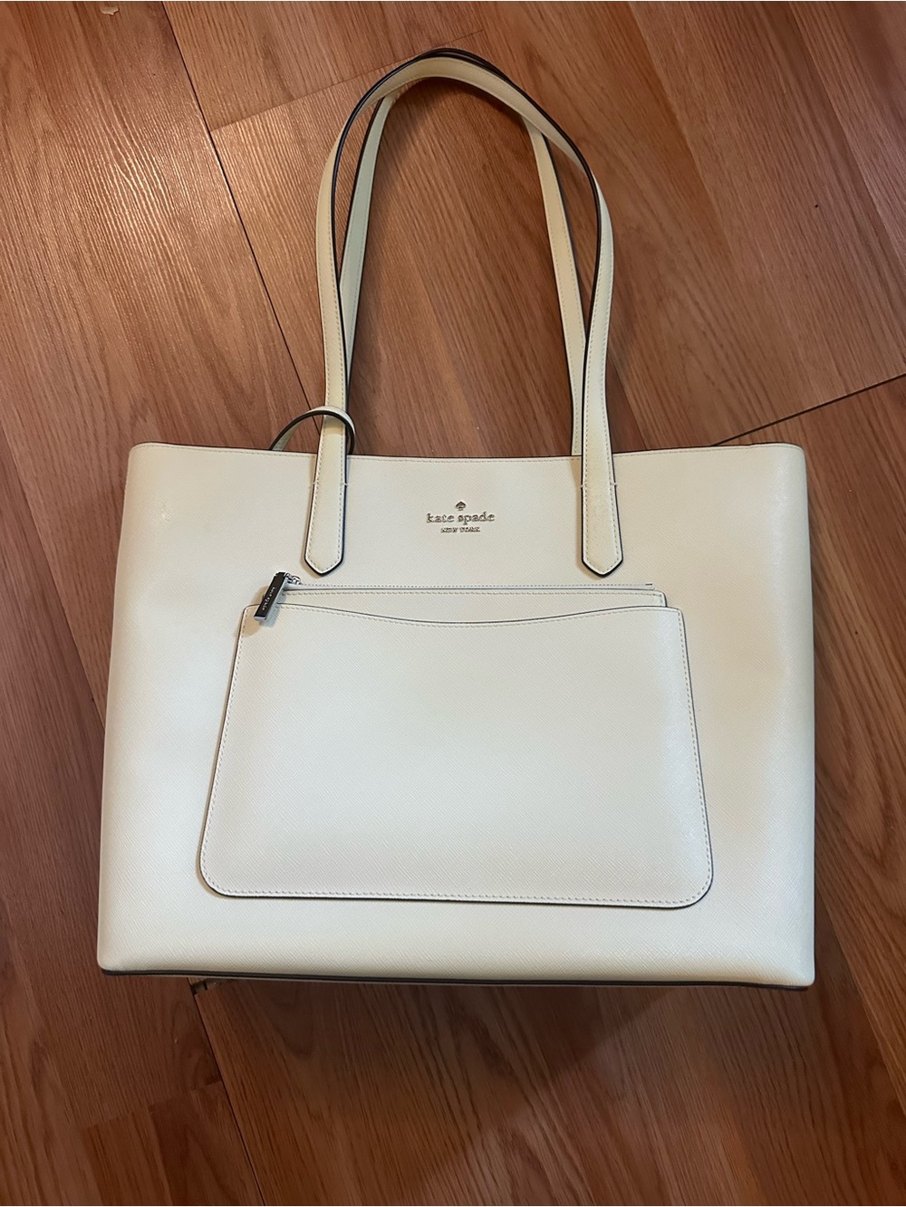 Kate spade light yellow to sells in the store under the name of Stacy